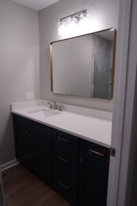 Same Countertops, Cabinets, and Finishes in Bathroom 2