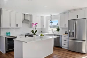 North Carolina kitchen remodeled by Housing Solutions, Inc., featuring new cabinetry, modern backsplash, and updated appliances.